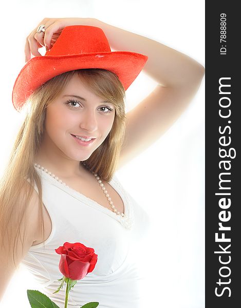 Beautiful young woman with rose on white background