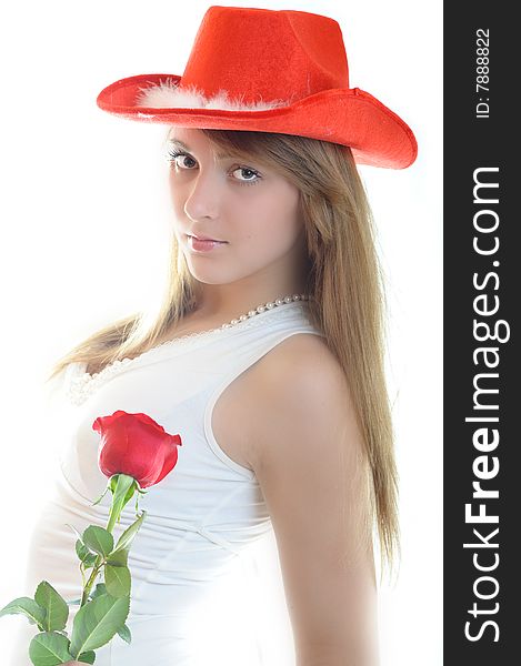 Beautiful young woman with rose on white background