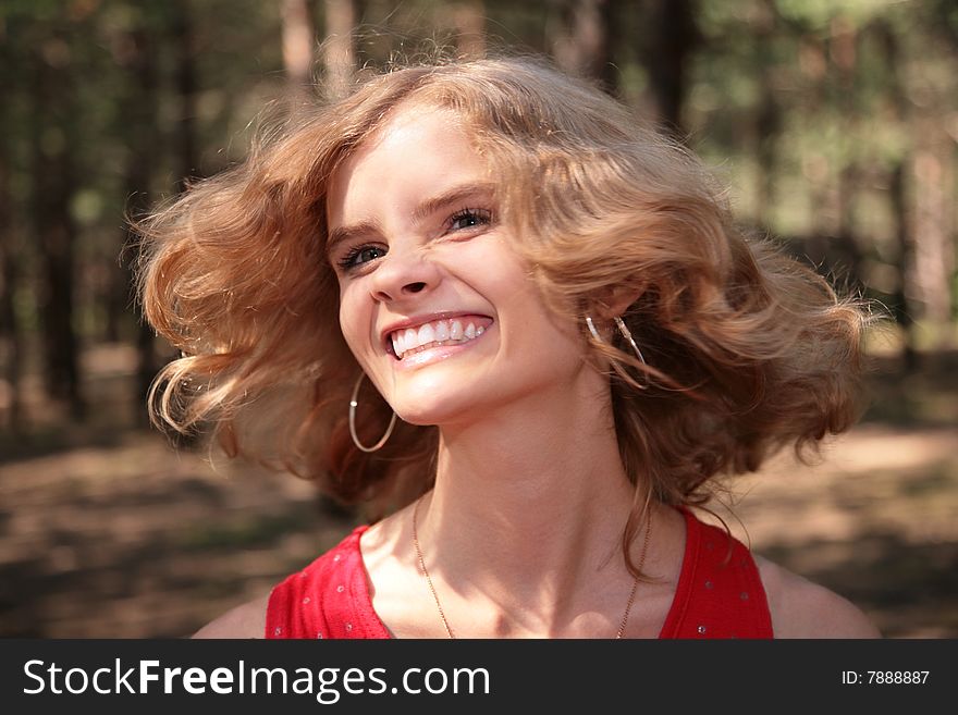 Young Smiling Blonde In Wood