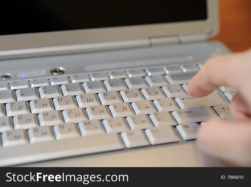 Closeup of a hand typing on keyboard. Closeup of a hand typing on keyboard