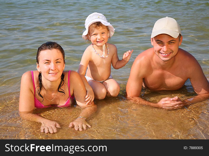 Family on beach, summer day