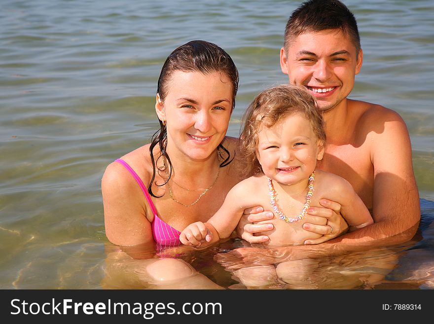 Family with daughter in sea. Family with daughter in sea