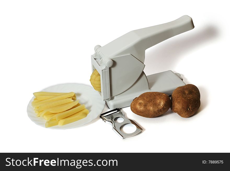 French Fries Cutter and peeler with potatoes isolated on white background. French Fries Cutter and peeler with potatoes isolated on white background