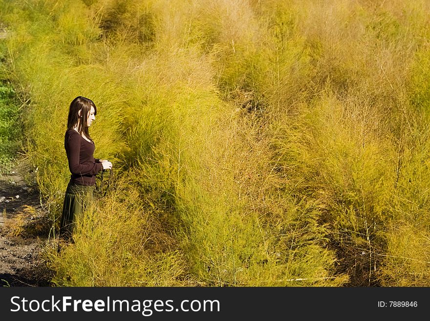 Young woman entering in a colorful field. Young woman entering in a colorful field.