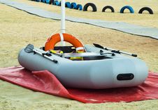 Inflatable Rescue Boat. Gray Inflatable Boat On The Beach In The Sand Royalty Free Stock Photo Inflatable Rescue Boat. Gray Inflatable Boat On The Beach In The Sand Royalty Free Stock Photo