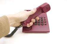 Male Hand Pick Up The Telephone On White Backgroun Royalty Free Stock Photography