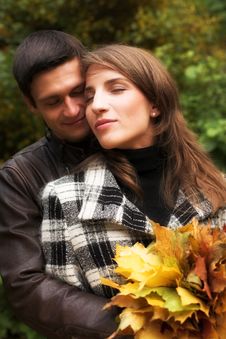 Loving Couple In An Autumnal Park Stock Images