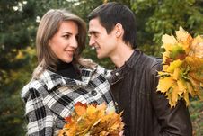 Loving Couple In An Autumnal Park Stock Photos