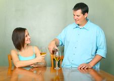 Young Couple Enjoying Wine On Kitchen Table Stock Photos Young Couple Enjoying Wine On Kitchen Table Stock Photos