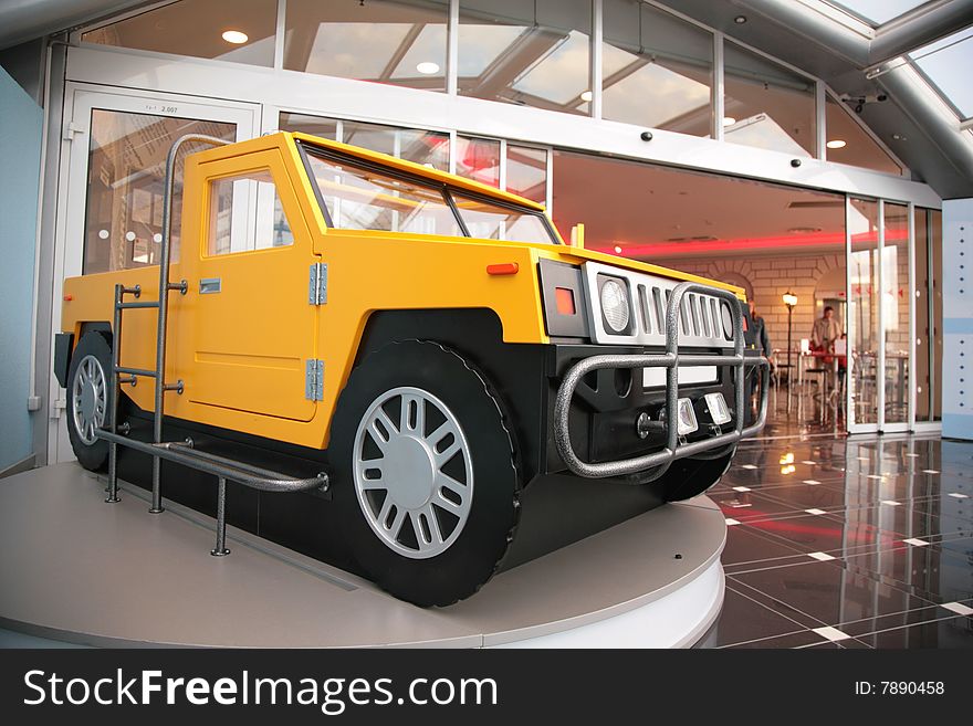 Model of off-road vehicle at  entrance into shopping center