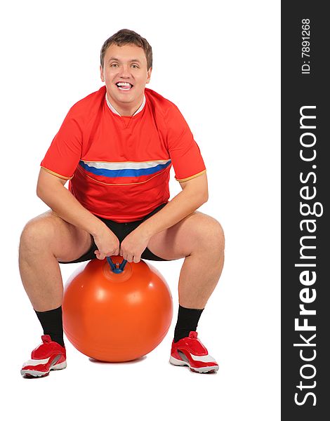 Man sitting on a fitness sphere on white. Man sitting on a fitness sphere on white.