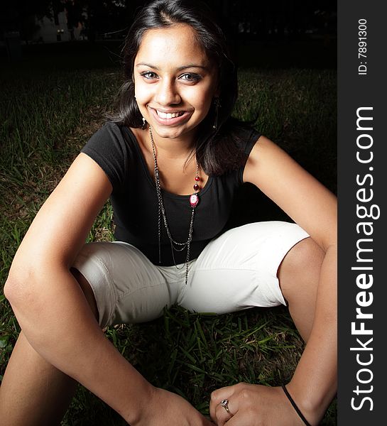 Woman sitting and smiling