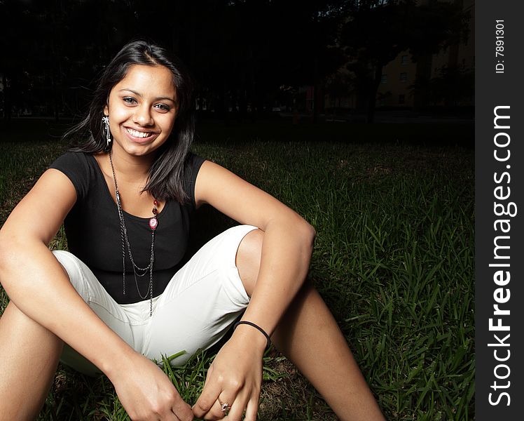 Woman sitting and smiling