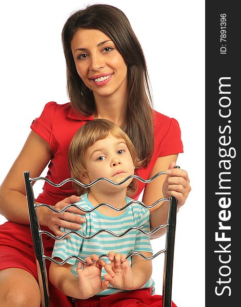 Girl and woman astride chair on white