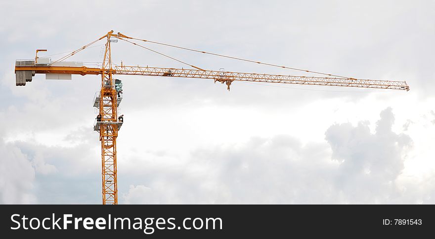 Elevating Crane And Sky With Clouds