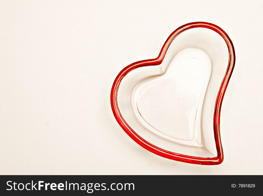 Isolated shot of glass heart shaped container in a white background.