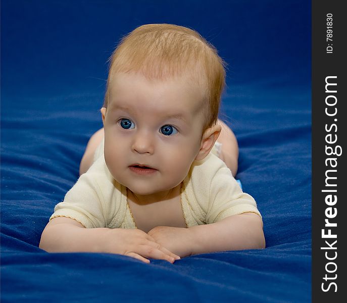 6 months old baby girl in a yellow outfit. 6 months old baby girl in a yellow outfit