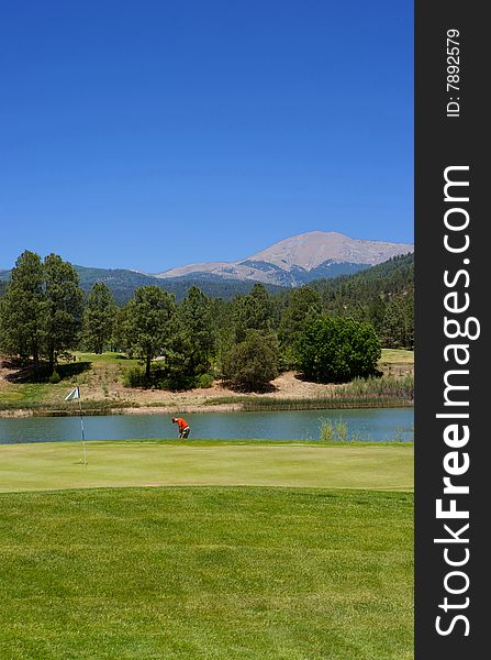 An image of a golfer preparing to swing on an Arizona course. An image of a golfer preparing to swing on an Arizona course