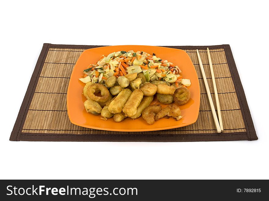 Plate full of seafood and chopsticks on a natural reed pad. Isolated on pure white. Plate full of seafood and chopsticks on a natural reed pad. Isolated on pure white.