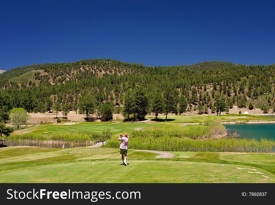 Golfer Following Through On A Swing