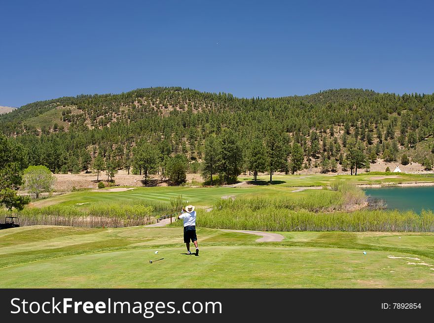 Golfer following through on a swing