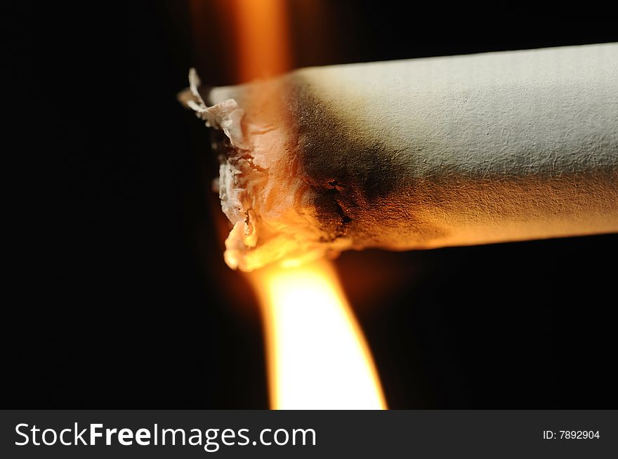 Macro photo of the moment of lighting up a cigarette. Macro photo of the moment of lighting up a cigarette