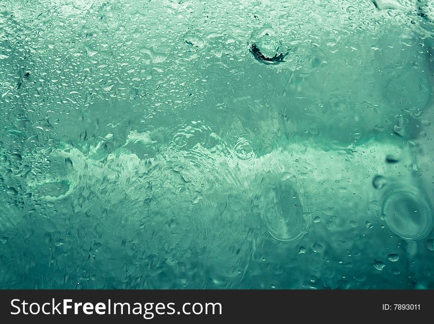 Abstract water-drops on the glass. Abstract water-drops on the glass