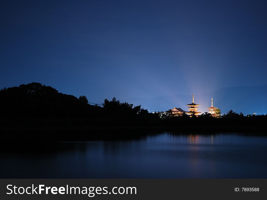 Night view of temple with light radiating, Nara, Japan