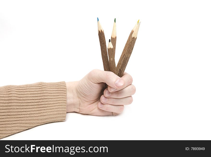 Man's hand with many color pencils on wite background