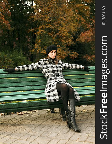 Young woman in autumnal park