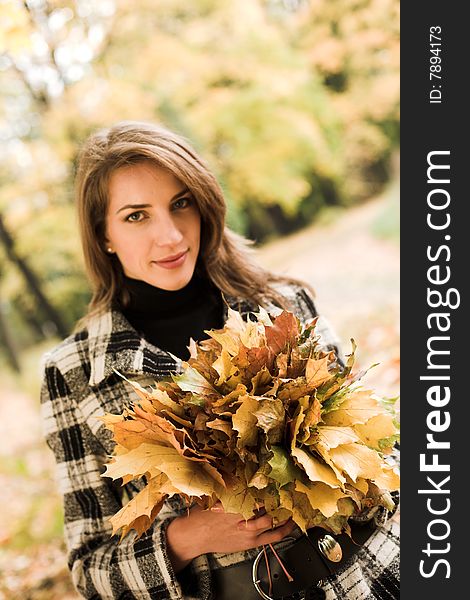 Young Woman In Autumnal Park