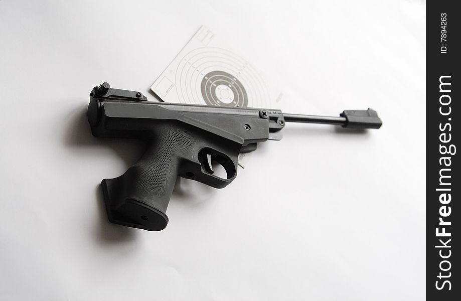 Close of of air pistol against the target