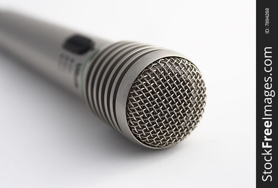 Close-up of wireless microphone on white background.