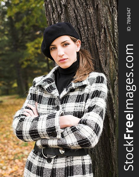 Young woman in autumnal park