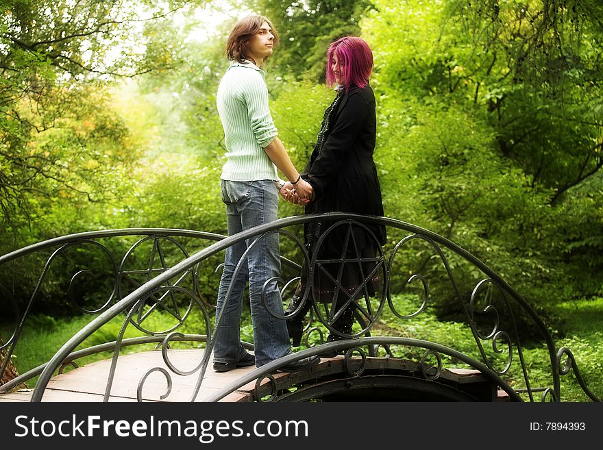 Young and beautiful boy  and girl  walking in park. Young and beautiful boy  and girl  walking in park