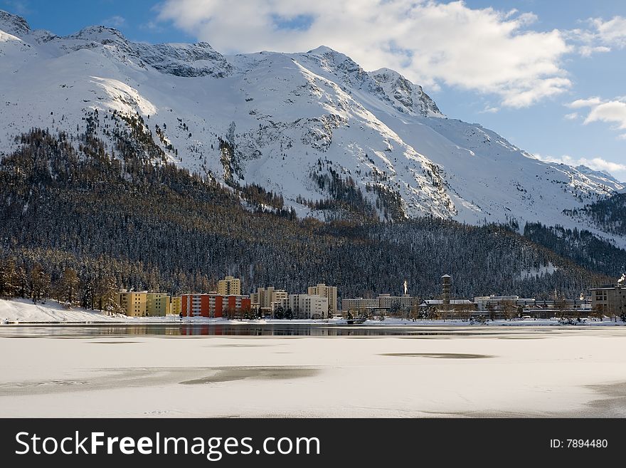 Modern hotels and apartments breaking the enchant of a snowy mountain environment in St. Moritz lake. Switzerland. Modern hotels and apartments breaking the enchant of a snowy mountain environment in St. Moritz lake. Switzerland.