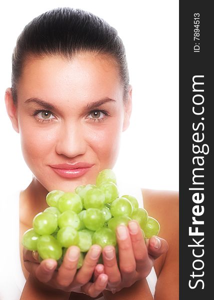 Studio portrait of a girl with a bunch of grapes isolated on white background. Studio portrait of a girl with a bunch of grapes isolated on white background