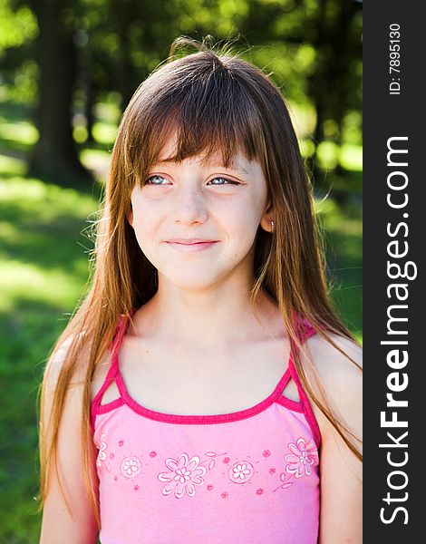 Portrait of young blond girl playing in the park. Portrait of young blond girl playing in the park