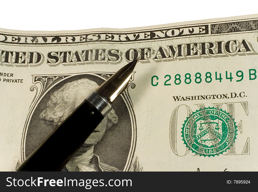 Closeup of a pen on dollar bills (isolated on white)