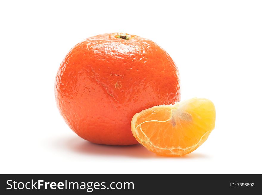 Tangerine and slice isolated on a white background. Tangerine and slice isolated on a white background.
