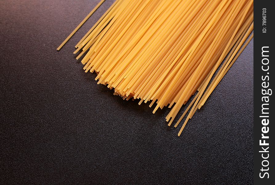 Italian spaghetti on a black background