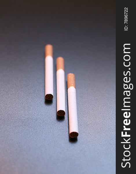 3 cigarettes on a black background