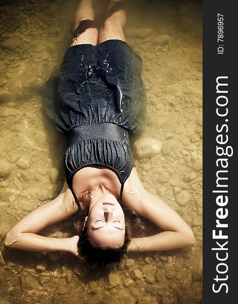 Young woman relaxing in the water. Young woman relaxing in the water