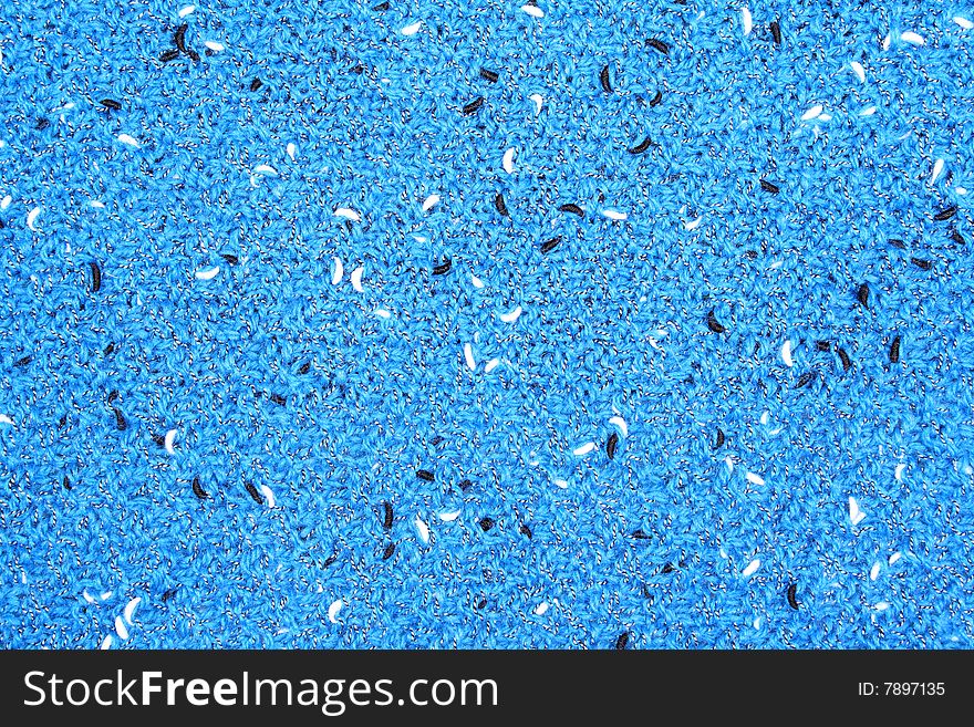 Impressive background from a natural wool yarn of blue color with black patterns. Impressive background from a natural wool yarn of blue color with black patterns