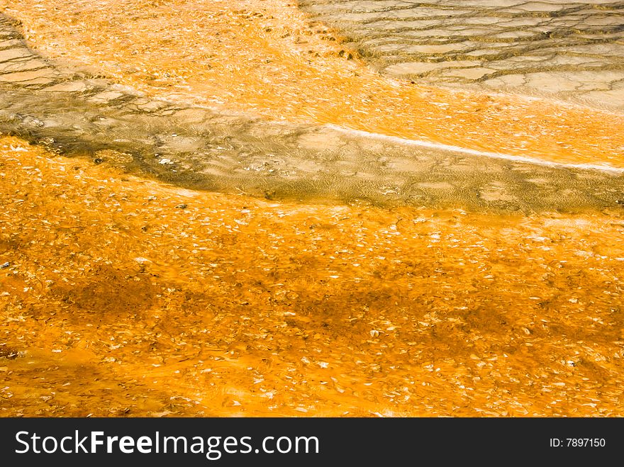 Colorful abstract patterns in a thermal pool in the geyser basins of Yellowstone National Park. Colorful abstract patterns in a thermal pool in the geyser basins of Yellowstone National Park