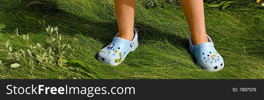 Blue shoes on green grass of Saint-Valery-Somme