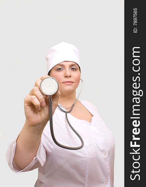 Young woman with stethoscope.Isolated.