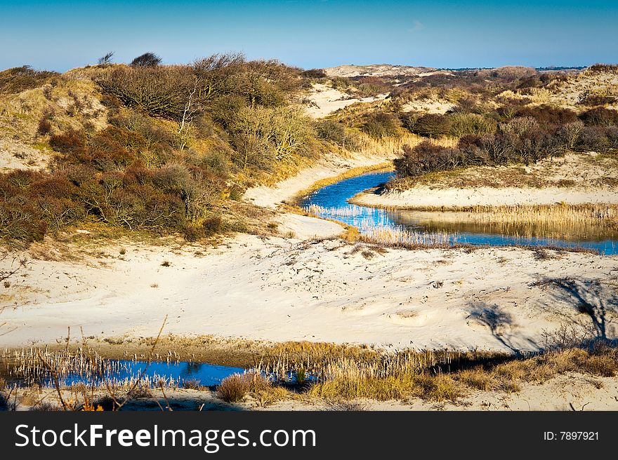Winter landscape wth river and dunes. North Sea coastline, The Netherlands. Winter landscape wth river and dunes. North Sea coastline, The Netherlands