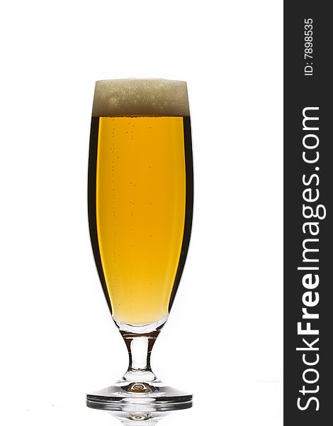 Glass of beer on white background