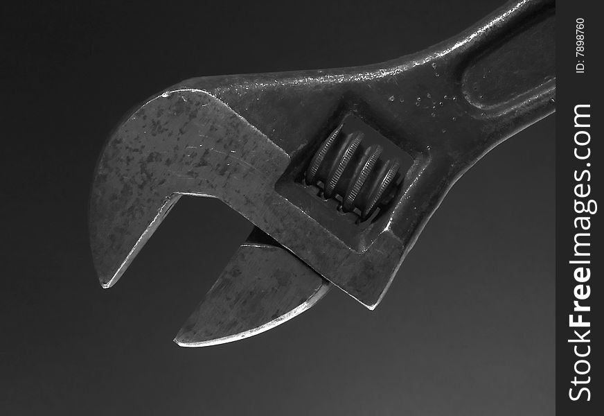 Flat wrench on dark background